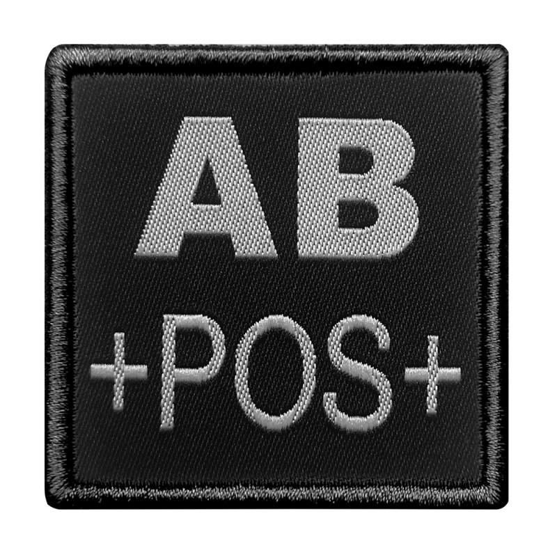 Groupe sanguin AB positif brodé sur tissu noir